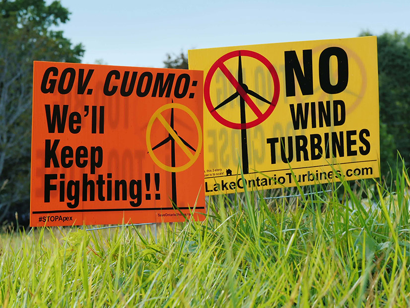 Signs photographed in 2017 reflect local opposition to a wind farm proposed in upstate New York.