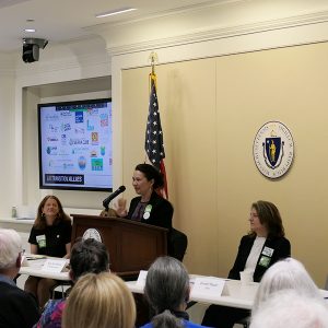 HEET cofounder Zeyneb Magavi addressing a crowd of legislators, aides, and activists at the Mass. State House