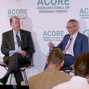 White House official John Podesta, right, talks with ACORE President Gregory Wetstone