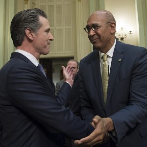 Assemblyman Chris Holden, right, seen here with Gov. Gavin Newsom, authored last year's ACR 188 and is said to be readying another attempt to expand CAISO's governance.