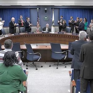 FERC Chair Richard Glick receives a standing ovation at the close of his final commission meeting.