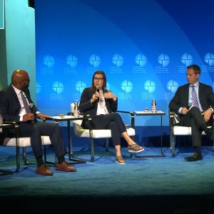 Heidi Binko, Just Transition Fund, speaks as (from left) moderator Jahi Wise, special assistant to the president on climate policy and finance; Mike Boots, Breakthrough Energy, and Ashvin Dayal, the Rockefeller Foundation, listen.