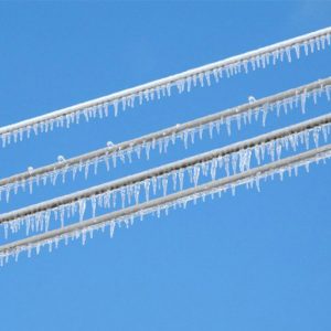 Ice hangs on power lines during the 2021 winter storm.