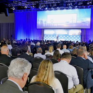 CLEANPOWER 2022 attendees listen to a presentation on the main stage.