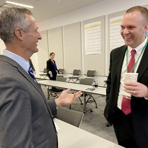 TAC Chair Clif Lange (right) catches up with ERCOT CEO Brad Jones during December's board meeting.