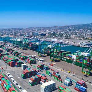 Port Cranes line up at the Evergreen Cargo Terminal at the Port of LA. The company was the first to begin switching from on-board diesel-powered generators to power its electric motors to cranes using electricity directly from the grid. The Port of LA is the largest of the nation's 360 seaports and ranked as the busiest. Diesel has traditionally powered all port equipment as well as the hundreds of large trucks at the port to picking up or returning a container.  Managed and operated by the Los Angeles Board of Harbor Commissioners,  the Port of LA is moving toward electrification of all equipment — with fuel cells running on hydrogen to batteries to direct grid connection — in order to reduce carbon dioxide and other more noxious emissions.