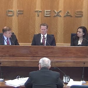 The Texas PUC's commissioners ... (left to right, Will McAdams, Peter Lake and Lori Cobos ... discuss a docket during their Oct. 28 open meeting.