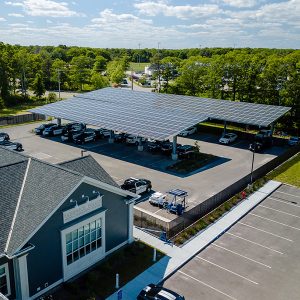 A solar canopy project over the police station in Sandwich, Mass., coordinated by the Cape and Vineyard Electric Cooperative that went online in March of this year.