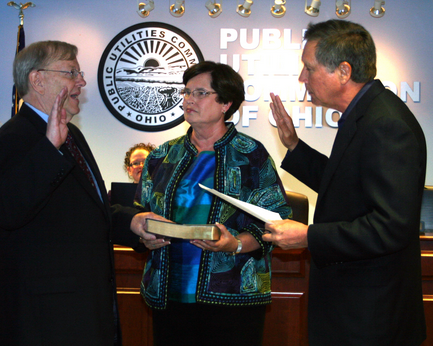 Kasich swears in Johnson as chairman of PUCO, one year ago this month.