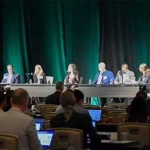 Western utility commissioners discussed the West-Wide Governance Pathway Initiative at CAISO's EDAM Forum in Las Vegas on Aug. 30. From left: Stacey Crowley, CAISO; Milt Doumit, Washington UTC; Alice Reynolds, California PUC; Letha Tawney, Oregon PUC; Kevin Thompson, Arizona Corporation Commission; Gabriel Aguilera, New Mexico PRC; Hayley Williamson, Nevada PUC.