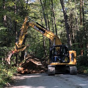 Crews work to move power lines underground for Green Mountain Power earlier this year.