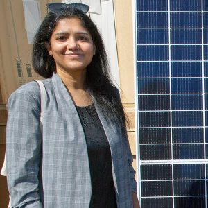 The New York Power Authority's new vice president of renewable project development, Venella Yadhati, stands with a solar panel near NYPA's headquarters in White Plains, N.Y.