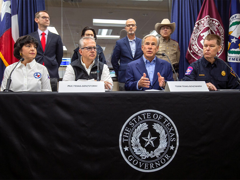 ERCOT CEO Pablo Vegas (2nd from left, front row) joins Texas Gov. Greg Abbott and other state officials for a press conference on the winter storm. 