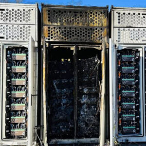 A rack of batteries after a UL 9540a unit fire test, with the middle unit burned out.
