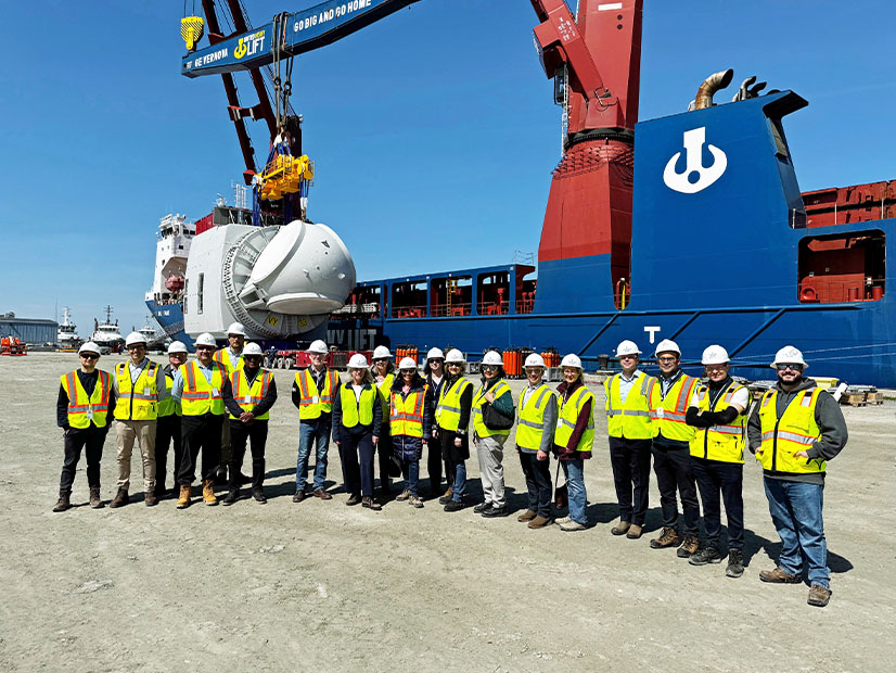 Members of the Board of Directors of ISO-NE tour the Port of New Bedford, Mass., where components were being loaded for construction of the Vineyard Wind 1 offshore wind farm in mid-May.