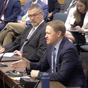 ERCOT COO Woody Rickerson (left) listens to Potomac Economics' David Patton during their comments to Texas PUC.