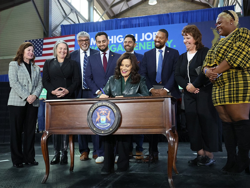 Michigan Gov. Gretchen Whitmer (D) signs clean energy and climate protection legislation in November 2023.