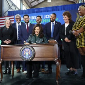 Michigan Gov. Gretchen Whitmer (D) signs clean energy and climate protection legislation in November 2023.