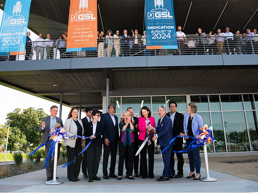 Cutting the ribbon at the Grid Storage Launchpad are (from left) Jud Virden, PNNL; Julie Turner, DOE; Jason Edwards (partially blocked), staff for Sen. Patty Murray (D-Wash); Harriet Kung, DOE Office of Science; Gene Rodrigues, DOE Office of Electricity; Geri Richmond, DOE Office of Science and Innovation; Washington State Sen. Matt Boehnke (R); Sen. Maria Cantwell (D-Wash.); Steve Ashby, PNNL; Mike Fong, Washington State Department of Commerce; and Ashley Stubbs, staff for Rep. Dan Newhouse (R-Wash).  