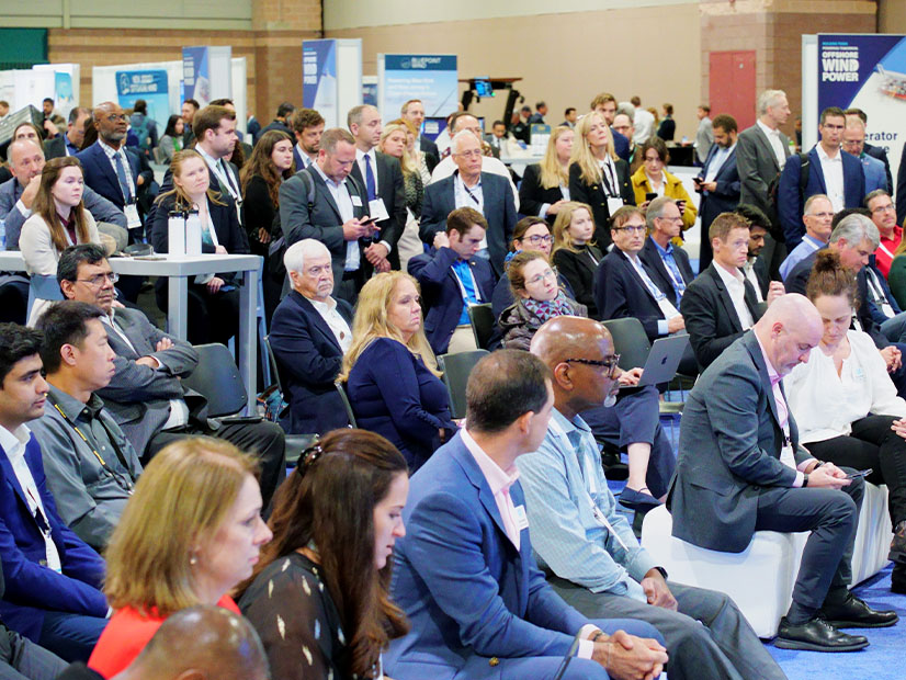 Attendees await a federal regulatory announcement at the American Clean Power Association’s Offshore WINDPOWER 2024 conference in Atlantic City, N.J., on Oct. 29.