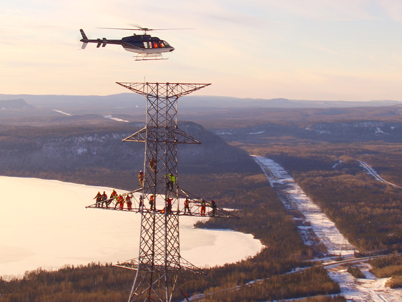 The East-West Tie is shown under construction in Ontario. NextEra Energy Transmission Canada is a partner.