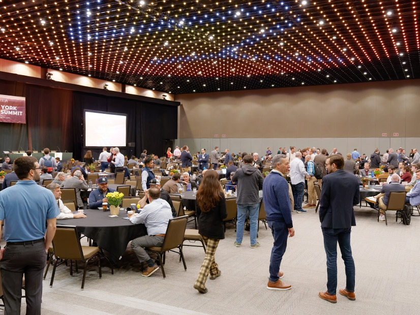 Attendees mingle during a break at the New York Solar Energy Industries Association 2024 Solar Summit on Nov. 7 in Albany, N.Y.