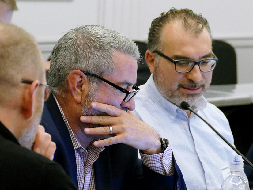 Snohomish PUD's Joe Fina (right) comments on an external adviser's role as Xcel Energy's Joe Taylor listens. 