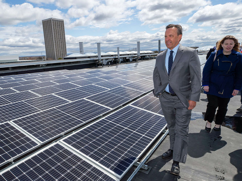 NYPA President Justin Driscoll walks through a 1.9-MW rooftop solar array the authority developed at the University at Albany in 2022. NYPA is gearing up to develop larger renewables projects than those it traditionally has undertaken.