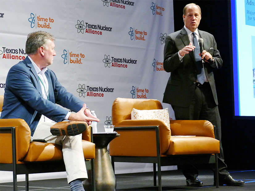 PUC Commissioner Jimmy Glotfelty (right), with Texas Nuclear Alliance President Reed Clay, details the report's recommendations during the Texas Nuclear Summit.