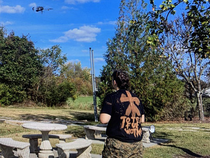 A photo released by the FBI shows Philippi taking the drone that he planned to use to destroy a substation for a test flight. The shirt he is wearing reads "Toten fur Wotan," a German phrase meaning "Death for Odin."