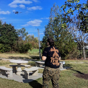 A photo released by the FBI shows Philippi taking the drone that he planned to use to destroy a substation for a test flight. The shirt he is wearing reads "Toten fur Wotan," a German phrase meaning "Death for Odin."