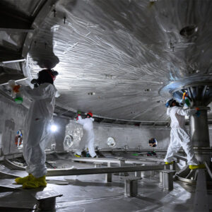 Commonwealth Fusion Systems personnel clean one of the cryostat chambers where the company tests magnets for SPARC, the tokamak nuclear fusion device it is designing.