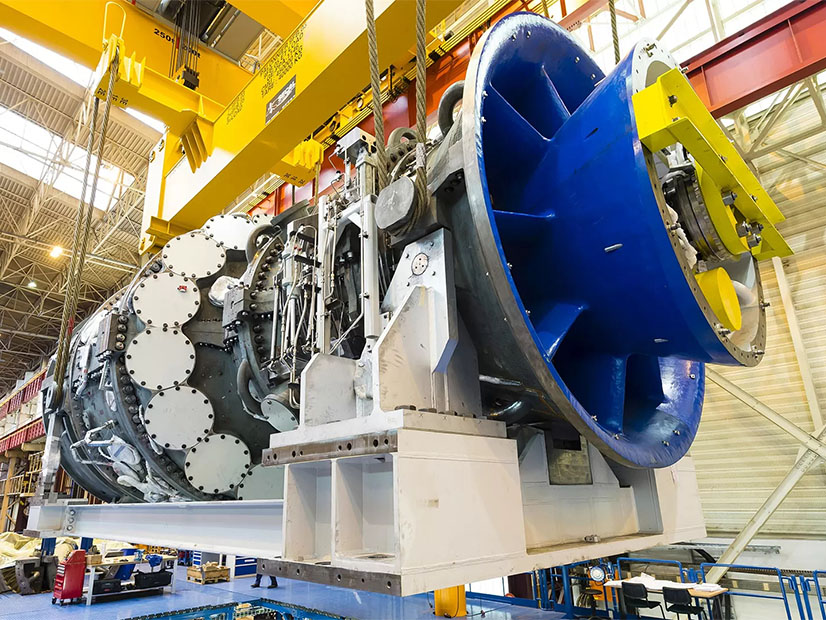 A GE Vernova H-class gas turbine is shown in production.