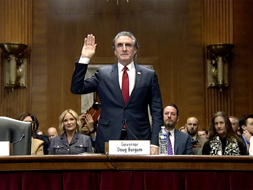 Former North Dakota Gov. Doug Burgum, nominee for interior secretary, is sworn in at his confirmation hearing before the Senate Energy and Natural Resources Committee on Jan. 16.