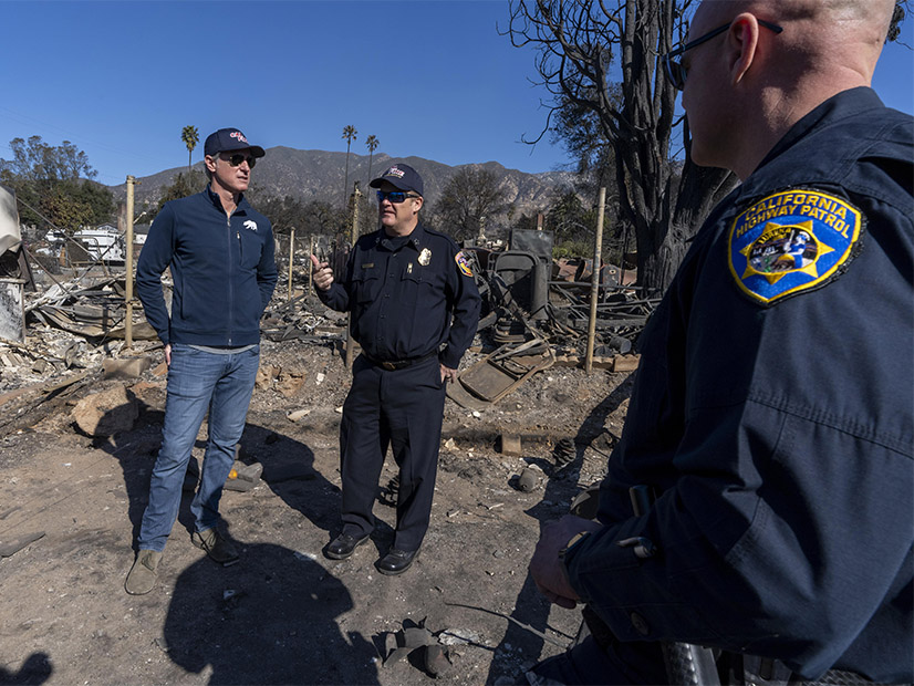 California Gov. Gavin Newsom, left, surveys damage from the Los Angeles wildfires. Newsom’s 2025/26 budget includes funding for wildfire mitigation along with a proposal to extend the state’s cap-and-trade program beyond 2030.