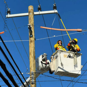 A DTE crew performs grid stability work in Wayne, Mich., in December. The Michigan utility is in line for billions in federal loan guarantees.