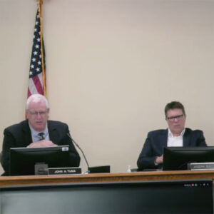 Commissioners John Tuma (left) and Joe Sullivan