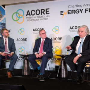 At the ACORE Policy Forum on Feb. 26, (from left) moderator Matthew Nelson, director of energy policy at Walmart, leads an on-stage conversation with former EPA Administrator Andrew Wheeler and former Energy Secretary Ernest Moniz.